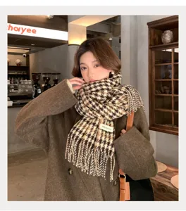 Detailed view of women autumn winter plaid fringe scarf, cozy warm neck wrap accessory.