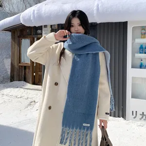 Elegant warm wool blend winter scarf for women, cozy tassel design, stylish cold weather accessory.