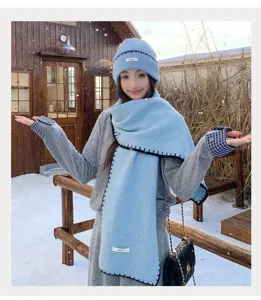 Cozy winter knit beanie and scarf set detail, soft blue thermal woolen hat and long muffler.