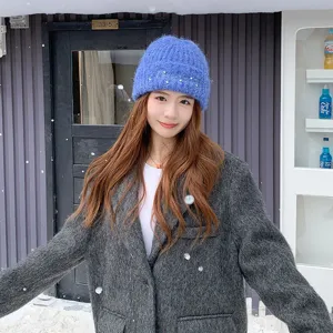 Winter thick warm wool knitted beanie hat for women with cute pearl and rhinestone embroidery.