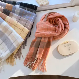 Detailed view of cozy plaid cashmere-feel winter tassel scarf in stylish color combinations.