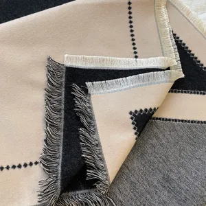 High quality double sided cashmere feel scarf shawl with geometric pattern and classic fringe.