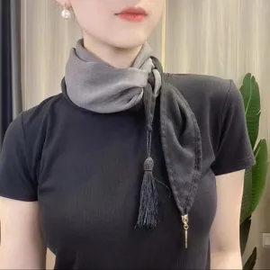 Women's two-tone neck scarf with tassel and metal pendant, versatile silk scarf main view.
