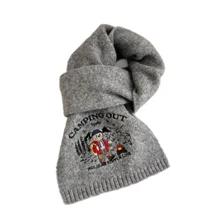 Grey knitted wool scarf featuring cute camping bear embroidery for winter warmth and daily style.