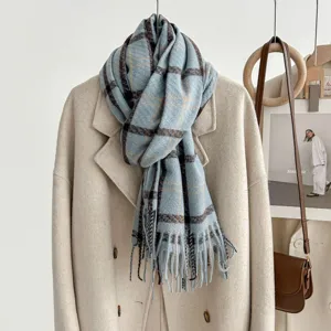 Blue plaid imitation cashmere scarf detail shot showing cozy winter texture and fringe edge.