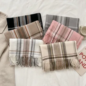 Autumn and winter plaid tassel imitation cashmere scarf, warm and versatile fashion accessory.