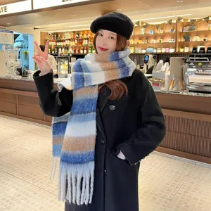 Detailed view of colorful mohair striped scarf, cozy warm fashion winter accessory.