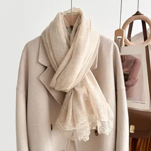Beige autumn winter scarf with elegant lace trim, soft cozy fabric neck wrap for women.