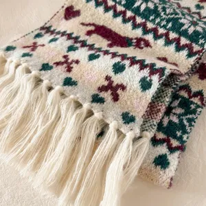 Fair Isle jacquard knitted scarf detail with charming heart patterns and cozy fringe for winter.