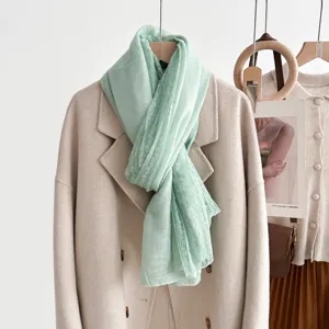 Mint green lace trim scarf for women, elegant lightweight thin shawl for spring and travel wear.