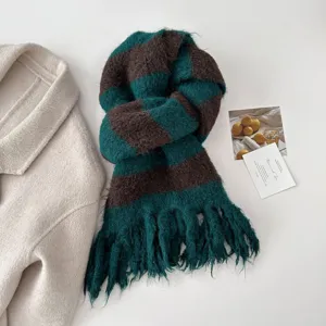 Detailed view of the cozy green and brown striped fringed scarf for autumn winter style.
