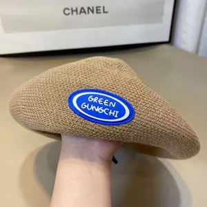 Khaki knitted beret for women, autumn winter retro casual painter hat with blue rubber patch.