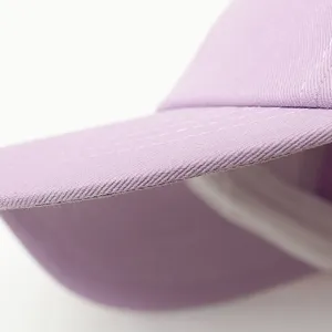 Lavender baseball cap detail shot, casual sunshade hat, trendy fashion accessory for women.