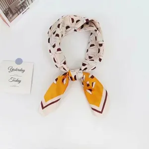 Detailed close-up of a chic women hat print silk square scarf tied neatly for daily styling.