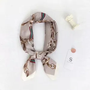 Elegant taupe silk square scarf with chain print and chic striped ribbon for women.