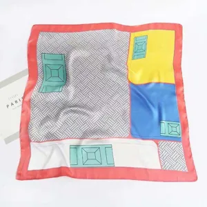 Detailed view of the printed satin silk square scarf featuring geometric color blocks.