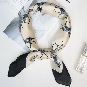 Elegant imitation silk square scarf with chic zebra pattern and black contrast corners.