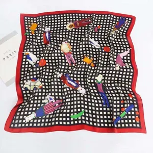 Detailed view of square silk scarf with checkered pattern and colorful artistic character prints.