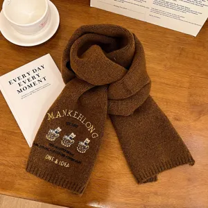 Cozy brown knitted scarf for women featuring cute bear embroidery and stylish letter details.