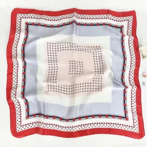 Elegant square silk scarf featuring a chic red border and geometric grid pattern for women.
