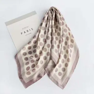 Polka dot satin scarf detail, showing smooth fabric texture and chic pattern for daily wear.
