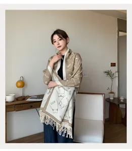 Detailed view of the thick warm women's shawl scarf with cute cat patterns and cozy fringes.