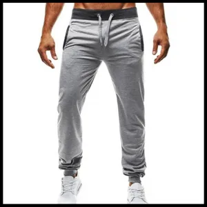 Men's light grey casual sweatpants with dark waistband, comfortable drawstring and cuffed ankles.