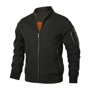 Detailed view of the black bomber jacket showing front metal zipper, sleeve pocket, and ribbing.