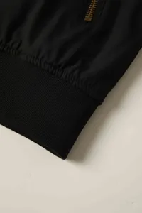 Detailed view of men casual bomber jacket with zipper pocket and ribbed hem design.
