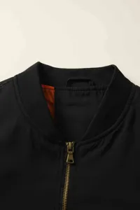 Men's black bomber jacket collar detail featuring a metal zipper and classic stand-up ribbed collar.