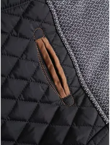 Men's casual color-blocked quilted jacket detail showing fine stitching and warm textured fabric.