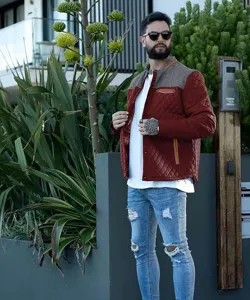 Detailansicht der gesteppten Herren-Outdoorjacke mit Tweed-Schulter und warmem Design.