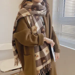 Cozy autumn winter plaid scarf with cute heart pattern and fringe. Soft and warm daily wear.