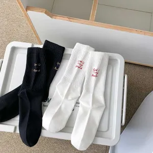 Calze da donna tinta unita con ricamo minimalista, calze elastiche alla moda per coppie.