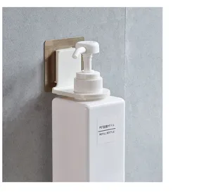 Detail view of wall-mounted shampoo bottle holder, punch-free bathroom organizer hook.