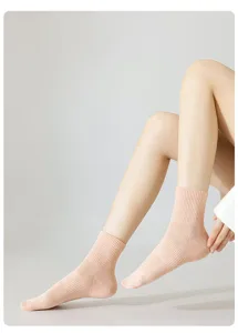 Detailed view of women's pink breathable mesh short socks, soft cotton ribbed ankle design.