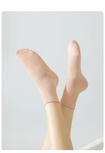 Detailed view of women's breathable mesh solid color short socks, soft cotton blend.