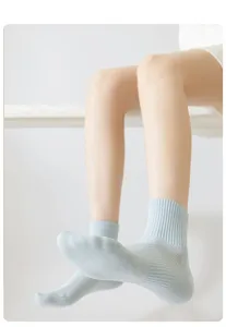 Detail view of light blue breathable mesh socks, showing soft ribbed cuff and fine texture.
