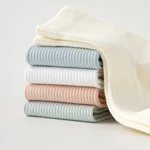 Solid color mesh short socks for women, breathable cotton summer casual socks stacked display.