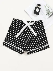 Black and white polka dot pajama shorts featuring a cute white ribbon bow for women sleepwear.