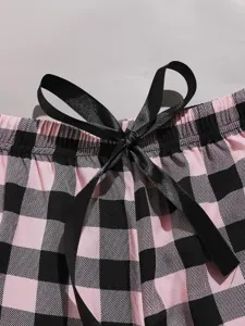 Pink and black buffalo plaid women lounge shorts detail with elegant black satin bow tie.
