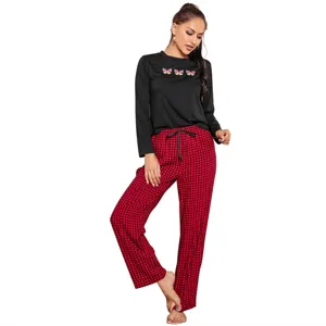 Women's long sleeve pajama set with cute butterfly print top and red plaid pants for cozy nights.