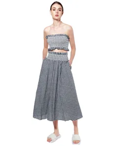 Black and white gingham two-piece set, smocked crop top and midi skirt detail view.