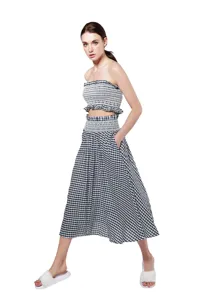 Black and white checkered two piece outfit featuring a strapless crop top and midi skirt.