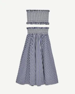 Blue and white gingham two-piece set featuring a strapless smocked crop top and midi skirt.