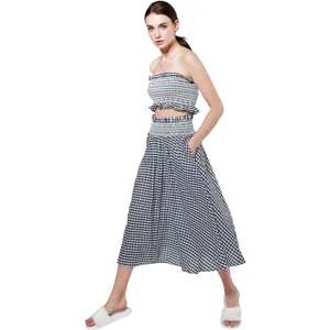 Black and white gingham two-piece set, strapless crop top and long skirt for summer beach.