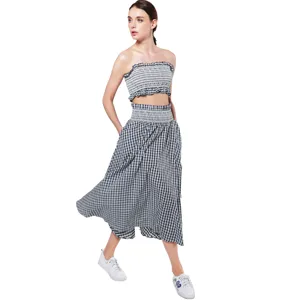 Chic black and white plaid two piece strapless crop top and maxi skirt outfit set for women.