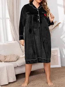 Black velvet sleepshirt detail, long sleeves with white piping, cozy home wear style.