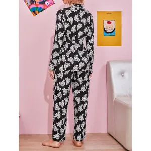 Women's long sleeve floral pajama set back view, comfortable two piece sleepwear with belt.
