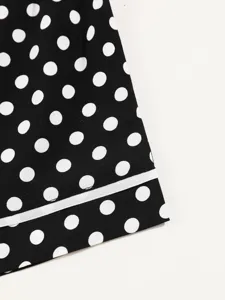 Black white polka dot loungewear shorts fabric detail with clean white piping edge design